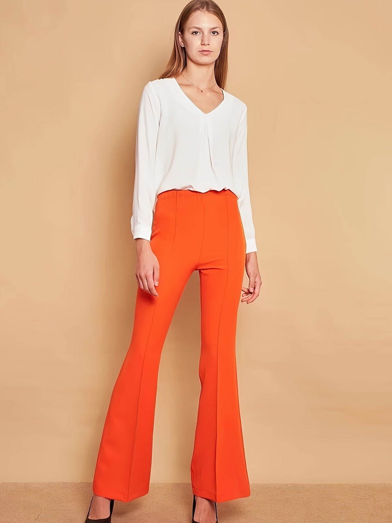 Lara - Oranje flare broek met hoge taille