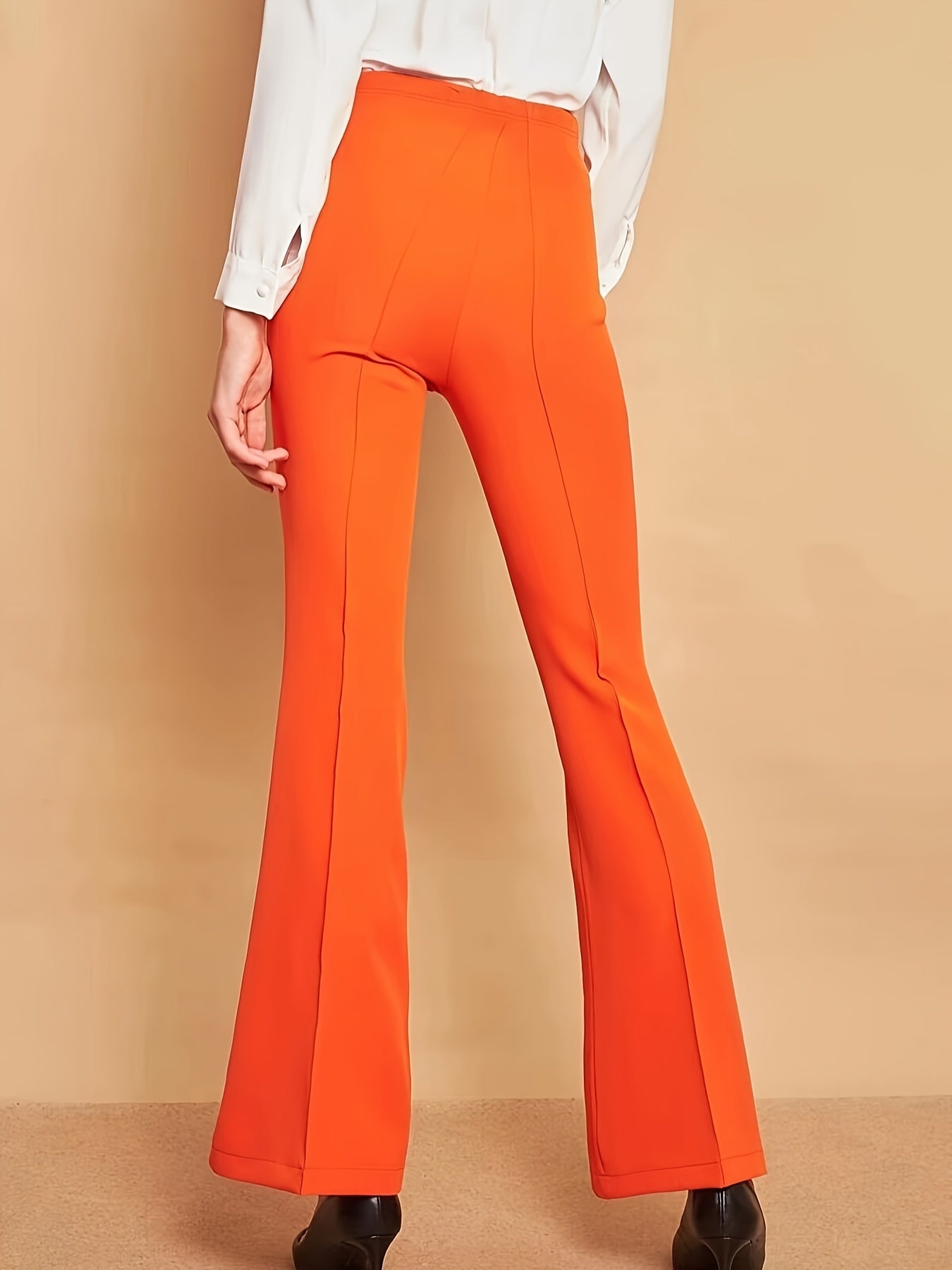 Lara - Oranje flare broek met hoge taille