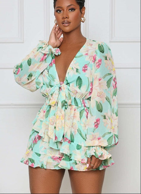 Mila - Mintgroene playsuit met bloemenprint