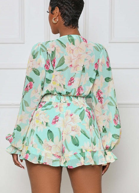 Mila - Mintgroene playsuit met bloemenprint